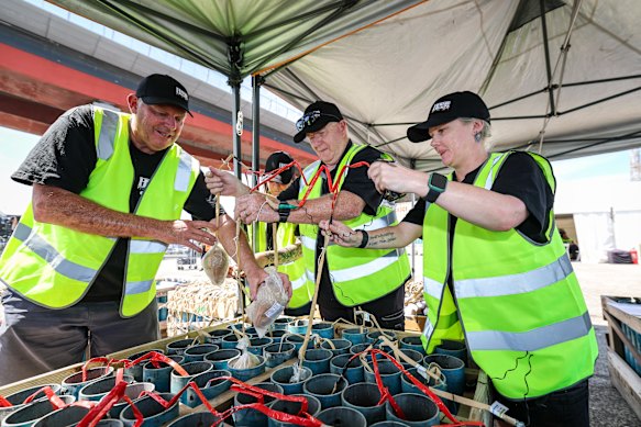 Rusty Johnson (centre) and team preparing fireworks for the New Year’s Eve display.
