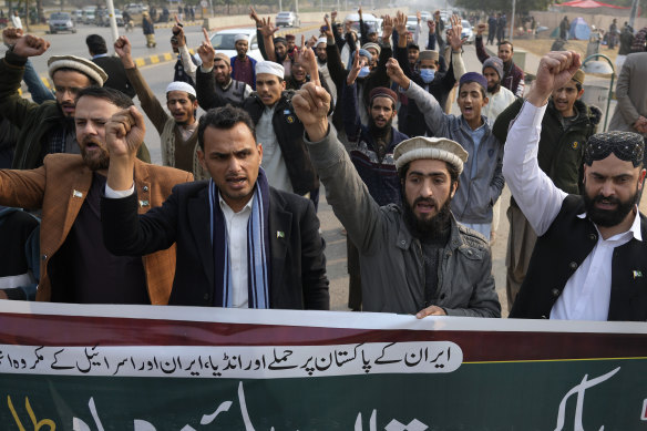 Members of Muslim Talba Mahaz Pakistan chant slogans in Islamabad, Pakistan, on Thursday, at a demonstration to condemn the Iran strike in the Pakistani border area.