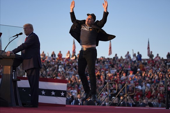 Elon Musk jumps on stage as Donald Trump speaks at a campaign rally in Pennsylvania in October.