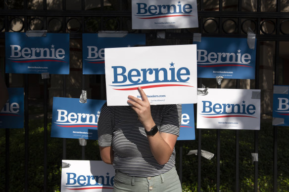 People show their support for Senator Bernie Sanders ahead of the Democratic presidential candidate debate in Houston, Texas.