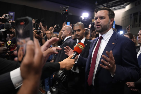 Republican vice presidential candidate J. D. Vance speaks to reporters in the “spin room” following the presidential debate.