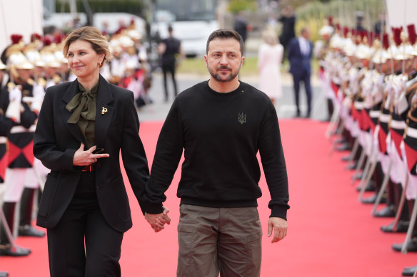 Ukrainian President Volodymyr Zelensky and his wife Olena Zelenska arrive at the international ceremony at Omaha Beach.