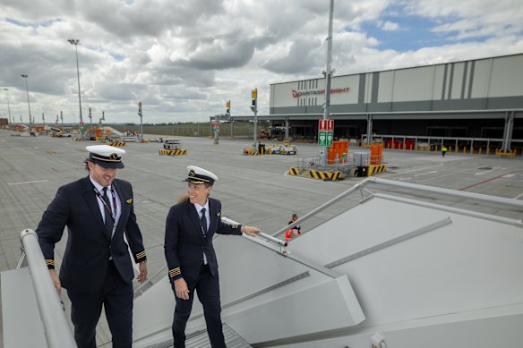 First officer Jay Bayliss and captain Taryn Lloyd walk onto the A321 aircraft parked at the cargo hub.