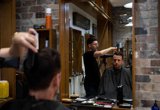 The Barber Shop's assistant manager Kaine Sinclair says the business was forced to shut for three weeks when its regular office worker clientele dried up.
