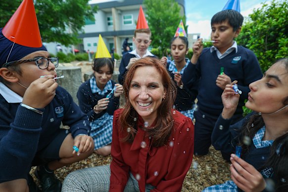 Principal Leanne Evans and year 6 students who will be the first to graduate from their school this year.