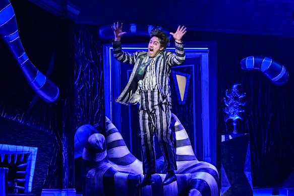 Eddie Perfect is in his element as an equally appealing and offensive agent of chaos.