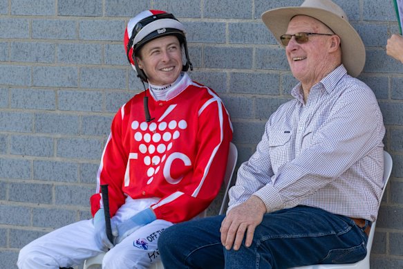 Harry Coffey talks with his dad, Austy, at the Echuca races in 2024.