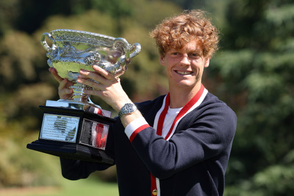 Jannik Sinner poses with the Australian Open trophy