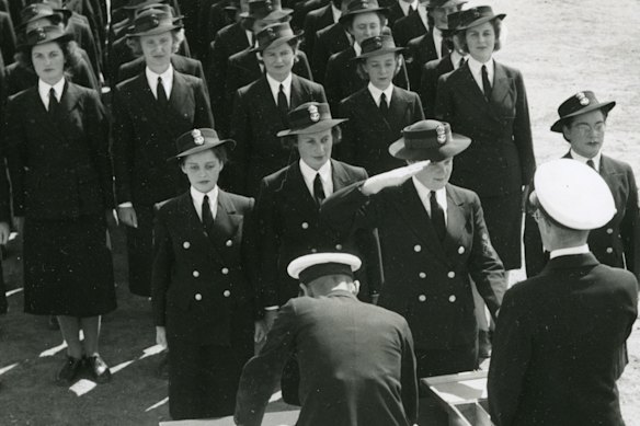 Gwenda Moulton, aged 19, front left (with six buttons), on pay day at HMAS Harman.