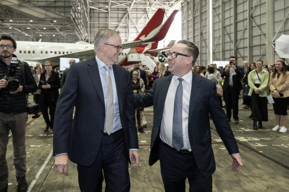 Prime Minister Anthony Albanese with then-Qantas chief Alan Joyce. Corporate giants such as Qantas, Wesfarmers, Rio Tinto and BHP have poured millions into the Yes campaign.