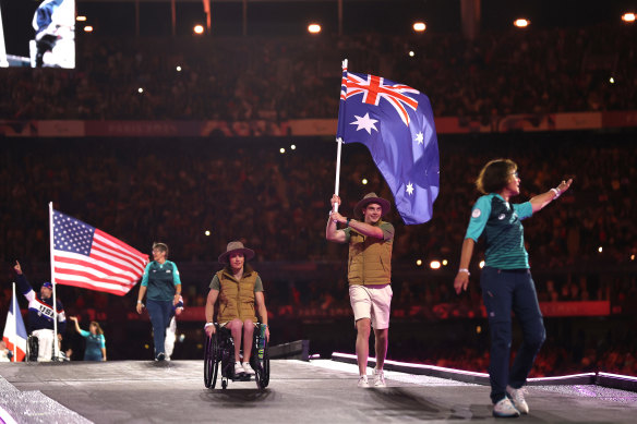 Lauren Parker and James Turner as flag-bearers at the closing ceremony.