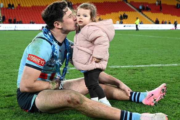 Mitchel Moses an Origin series win celebrates with his daughter Aspyn and a ruptured biceps.