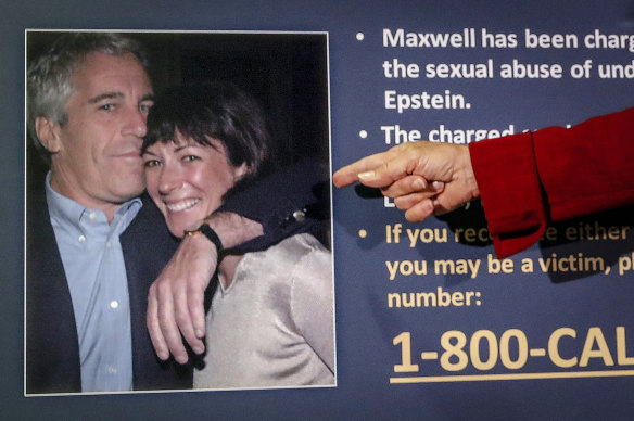 A US attorney points to a photo of millionaire Jeffrey Epstein and British socialite Ghislaine Maxwell during a news conference last year.