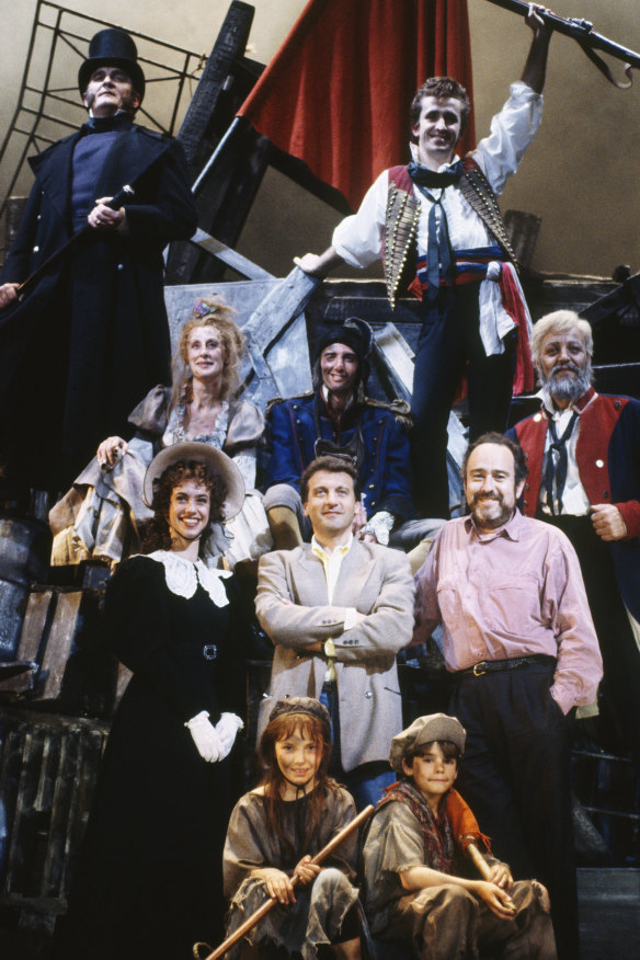 Alain Boublil and Claude-Michel Schoenberg with cast members from an early production of Les Miserables.