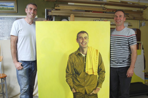 Ross Townsend (right) at his Gordon studio with the retired yellow Wiggle, Greg Page, and his portrait, in 2013.