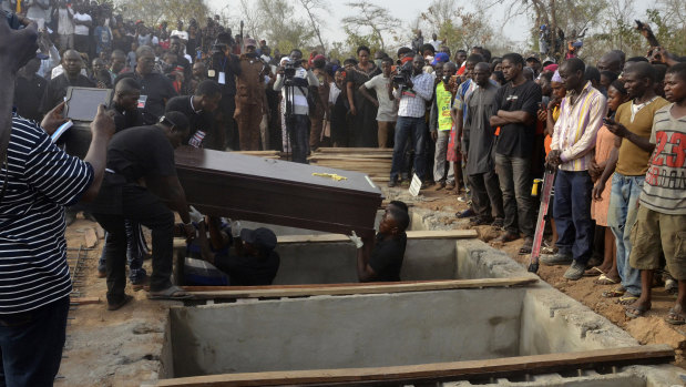 Volunteers handle coffins during a mass funeral for victims of attacks in  Nigeria earlier in January in a series of attacks blamed on Fulani herdsmen who oppose a new anti-grazing law. 