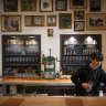 A photo gallery behind the cocktail bar tells the Enter Via Laundry story.
