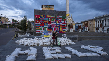 Flags are displayed from around the world and sandbags spell out “HELP” in Kyiv’s Maidan Square on June 25.