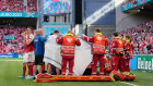 Medics and the Danish soccer team surround Christian Eriksen on the pitch after he suffered a medical emergency.