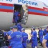 Russian Emergency Ministry employees leave one of two planes that landed in Myanmar following Friday’s earthquake.