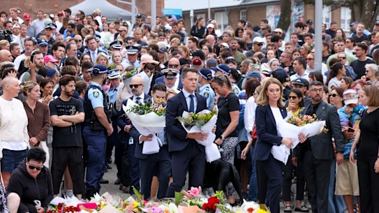 NSW Premier Chris Minns laying flowers outside Bondi Pavilion on Monday.