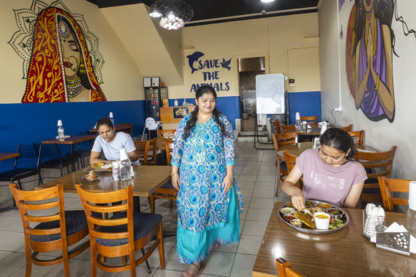 Mittal Ghosh Roy presides over the restaurant’s simple room painted with colourful murals.