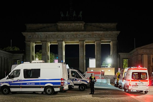 Police stand guard at the famous Brandenburg Gate following the deadly attack.