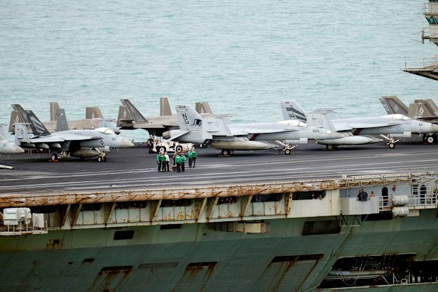 The USS Abraham Lincoln is seen covered in rust as it docks in Thailand.