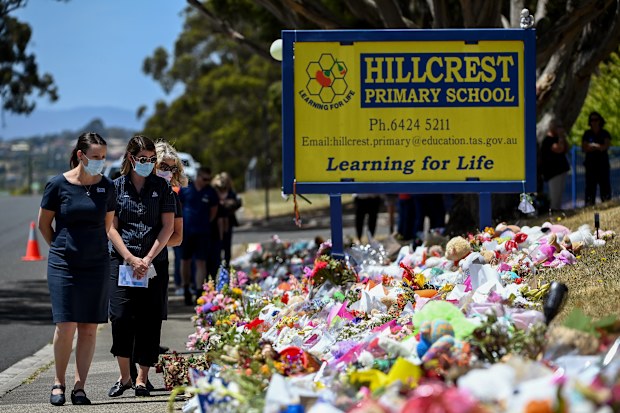 Health care workers from Mersey Community Hospital pay their respects outside Hillcrest Primary School in Devonport back in 2021.