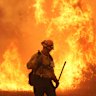 A firefighter battles the Canyon Fire on Thursday in Hasley Canyon, California.