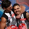 Teammates Lachie Schultz and Bobby Hill muck around at the launch of the AFL’s Sir Doug Nicholls round.