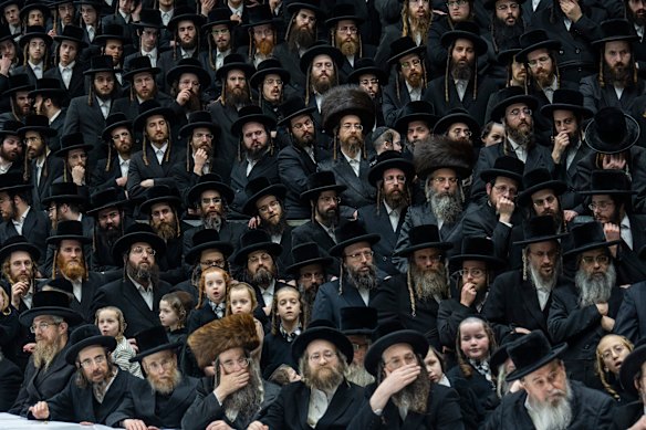 Ultra-Orthodox Jews of the Darag Hasidic dynasty celebrate the Jewish feast of ‘Tu Bishvat’ or “New Year of the Trees,” as they sit with their rabbis around a long table filled with all kinds of fruits, in the ultra-Orthodox town of Bnei Brak, Israel.