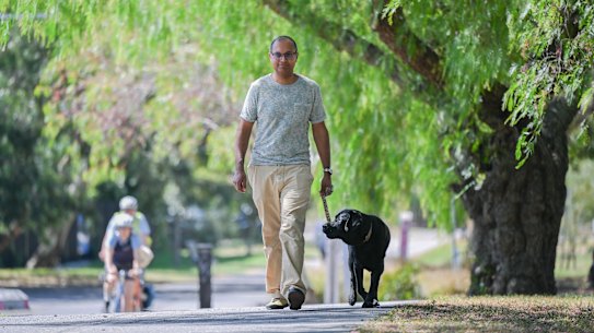 Sudhan Mistry walks his dog Cola in Fitzroy North.