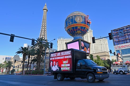 Ahead of the midterm elections, a mobile billboard travels down the Las Vegas Strip on Friday.