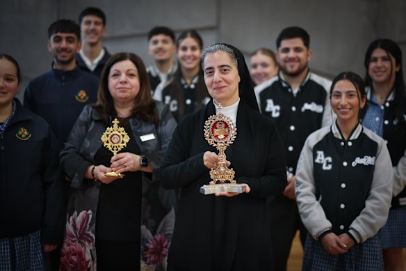 Sister Veronique Karam holding the reliquary of St Carlo Acutis with students at Antonine College, a Maronite Catholic school in Pascoe Vale South, attended a mass and offered prayers with a relic of English-born Italian boy St Carlo Acutis, who died age 15 in 2006 and was canonised in 2025 by Pope Leo XIV.