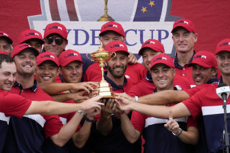 Team USA players and captains with the trophy.