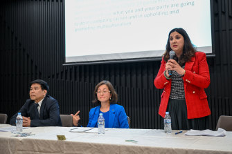 Carina Garland speaks at a candidate forum in Mount Waverley on May 10, with Liberal MP Gladys Liu (seated) and independent Wayne Tseng.