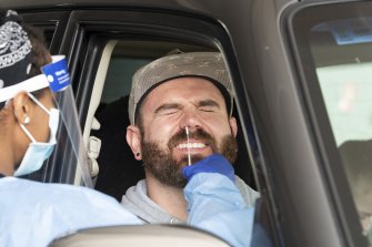 A man gets tested for COVID at a drive-through clinic in Joondalup. 