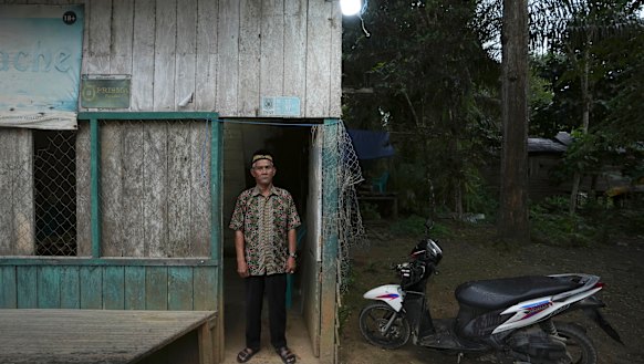 Balik tribe leader Sibukdin stands outside his house in Penajam Paser Utara near where construction has begun on Indonesia’s new capital city.