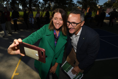 Greens candidate for Macnamara Steph Hodgins-May takes a selfie with party leader Richard Di Natale on Saturday.