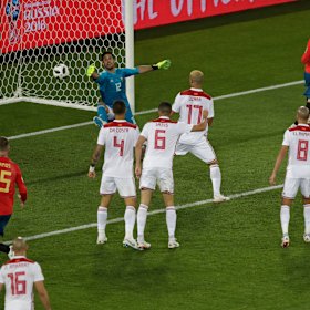 Morocco goalkeeper Munir El Kajoui fails to keep out Iago Aspas' flick.