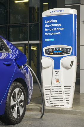 A Hyundai Ioniq at a charging station. Infrastructure Australia has identified a nationwide fast-charging network as a high priority.