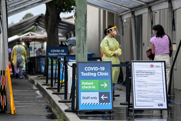 Healthcare workers man the COVID-19 testing clinic at RPA on Sunday.