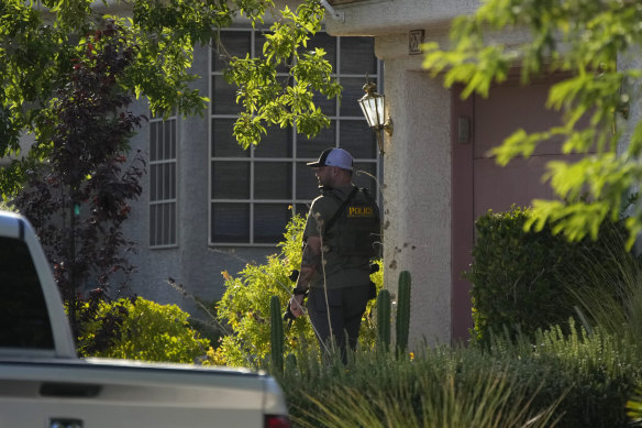 Police outside the home of Robert Telles.