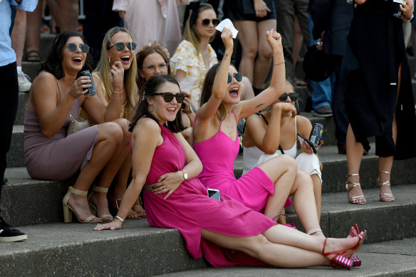 Racegoers cheering during Golden Eagle Day at at Rosehill Gardens.