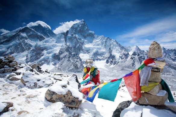 Prayer flags on top of the mountain Kala Pattar in Nepal.