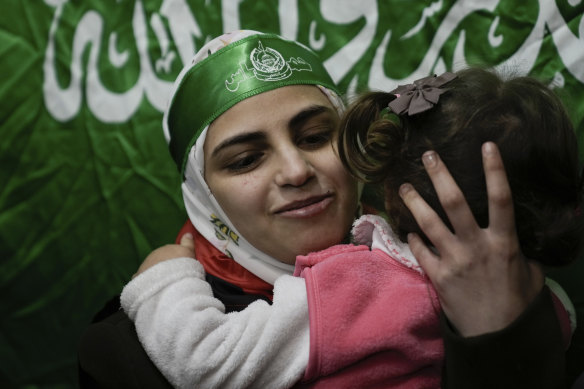 Aseel al-Titi is greeted by friends and family in Balata in the West Bank after being released from Israel.