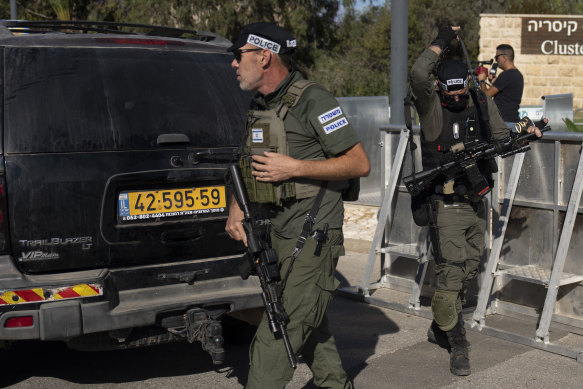 Israeli security forces secure a road near where Israel’s government says a drone was launched toward Israeli Prime Minister Benjamin Netanyahu’s house.