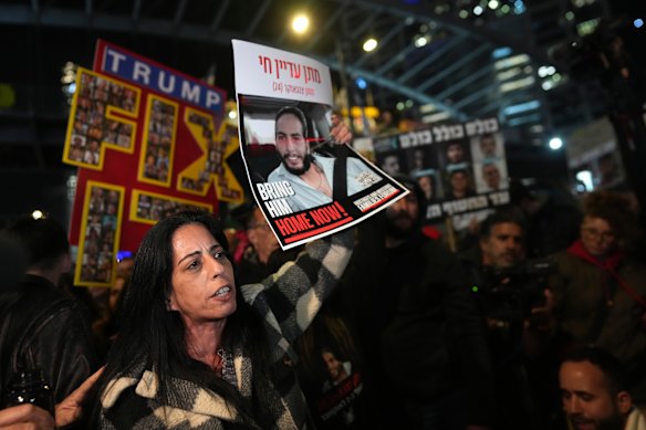Einav Zangauker holds a poster of her son, Matan, at an earlier protest in February.