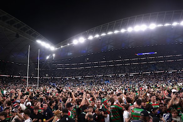 The crowd floods onto Allianz Stadium after Alex Johnston scored.